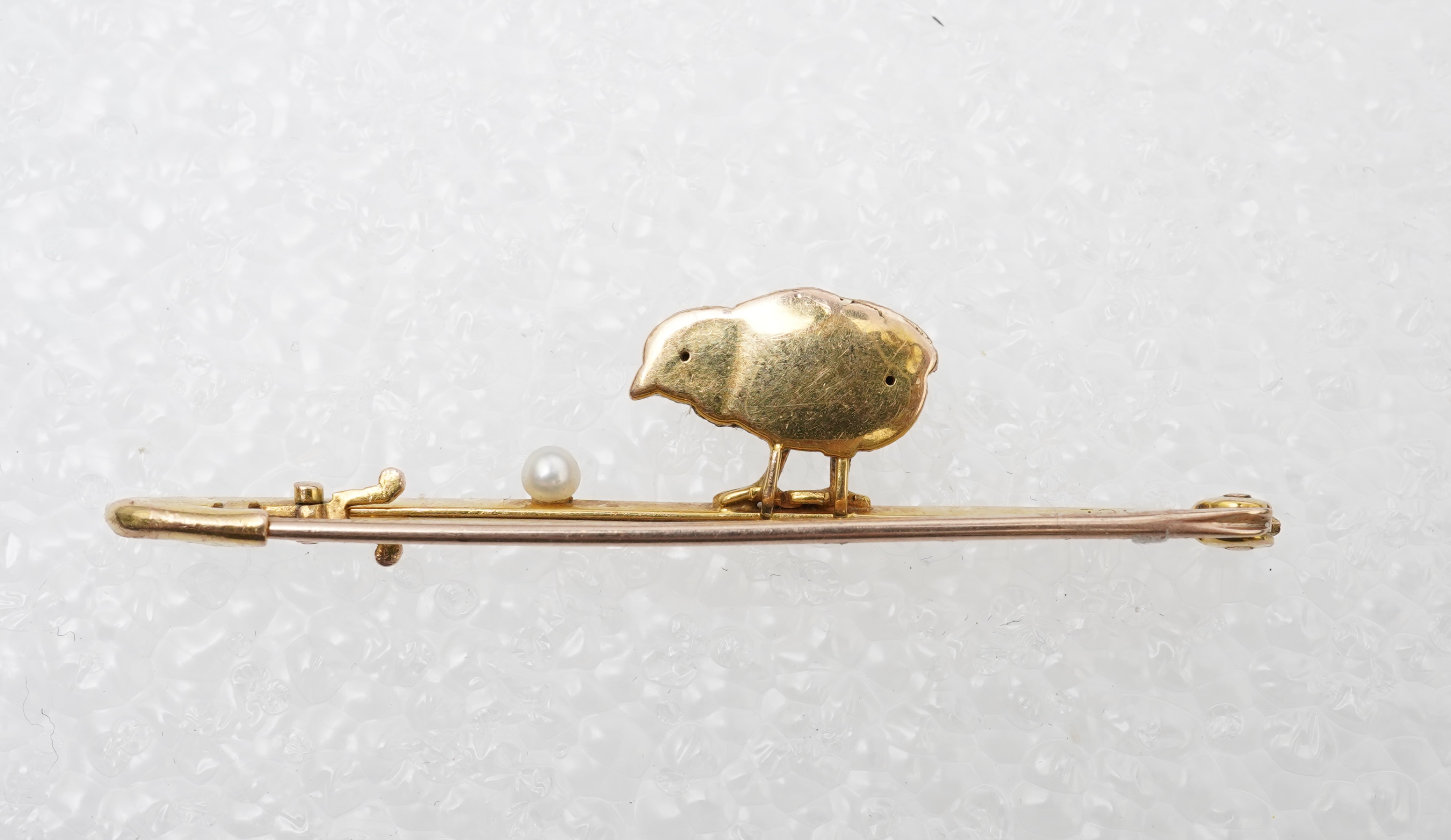 A gold and seed pearl novelty bar brooch, circa 1900
